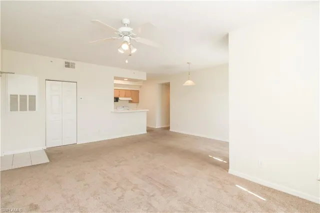 a view of an empty room with a window