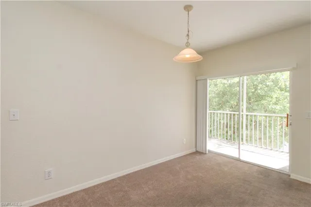 a kitchen with a sink a stove a refrigerator and white cabinets