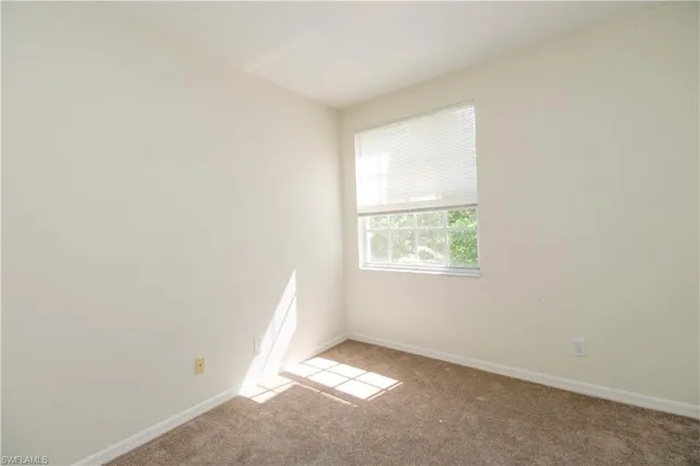 a view of a big room with a ceiling fan