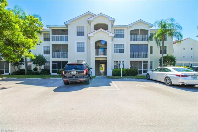 a view of a street with houses on both side