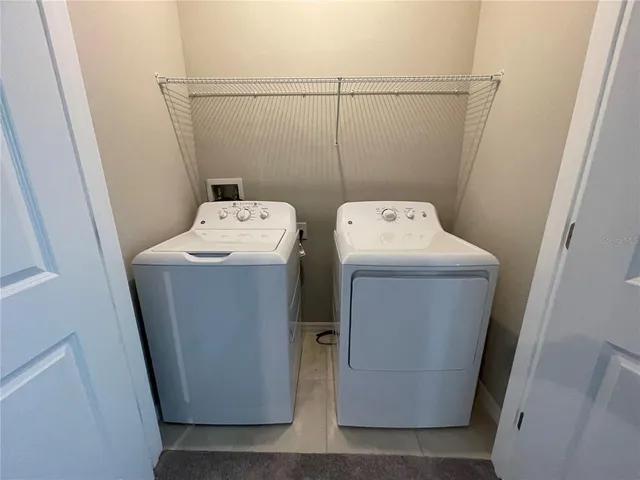 a utility room with dryer and washer