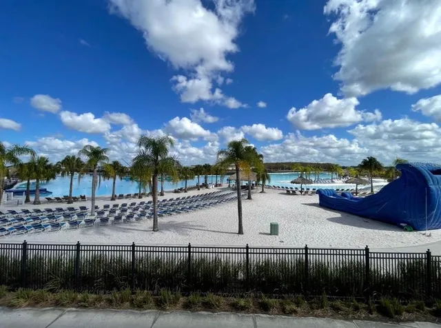 a view of swimming pool and outdoor seating