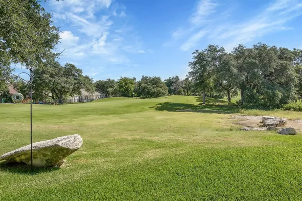 a view of a golf course with a lake view