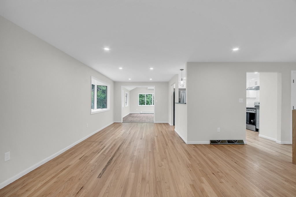 67 Hall Road Chelmsford, MA 01824 - Photo 14 of 35 wooden floor in an empty room with a window