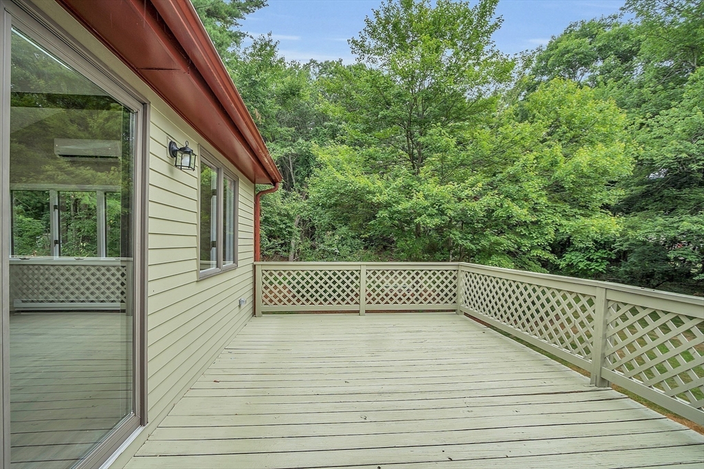 67 Hall Road Chelmsford, MA 01824 - Photo 8 of 35 a view of a balcony with wooden floor