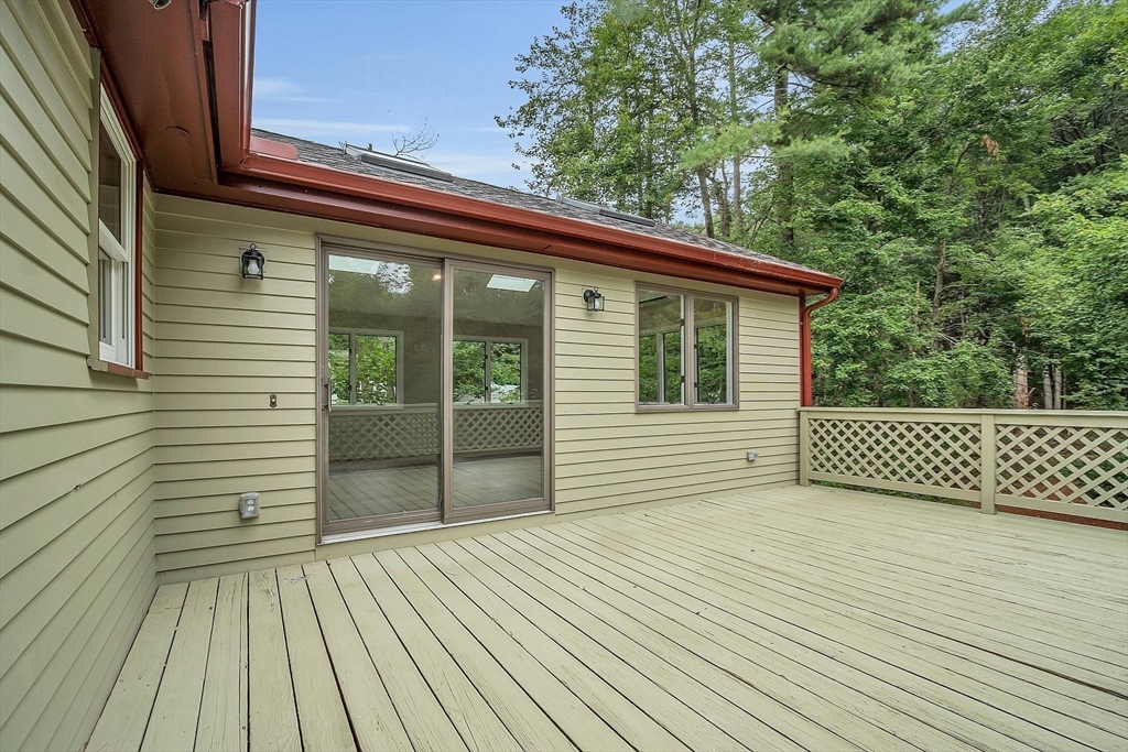 67 Hall Road Chelmsford, MA 01824 - Photo 9 of 35 a view of a balcony with wooden floor