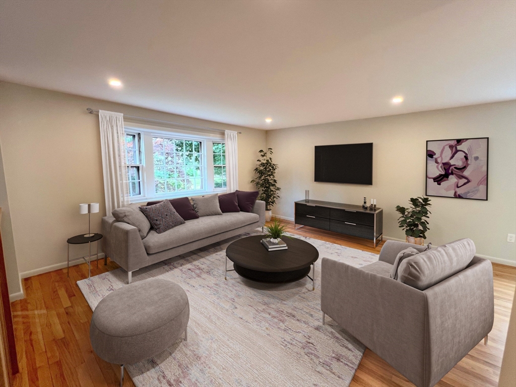 67 Hall Road Chelmsford, MA 01824 - Photo 10 of 35 a living room with furniture and a flat screen tv