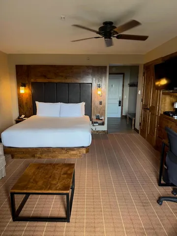 a room with pool table and wooden floor