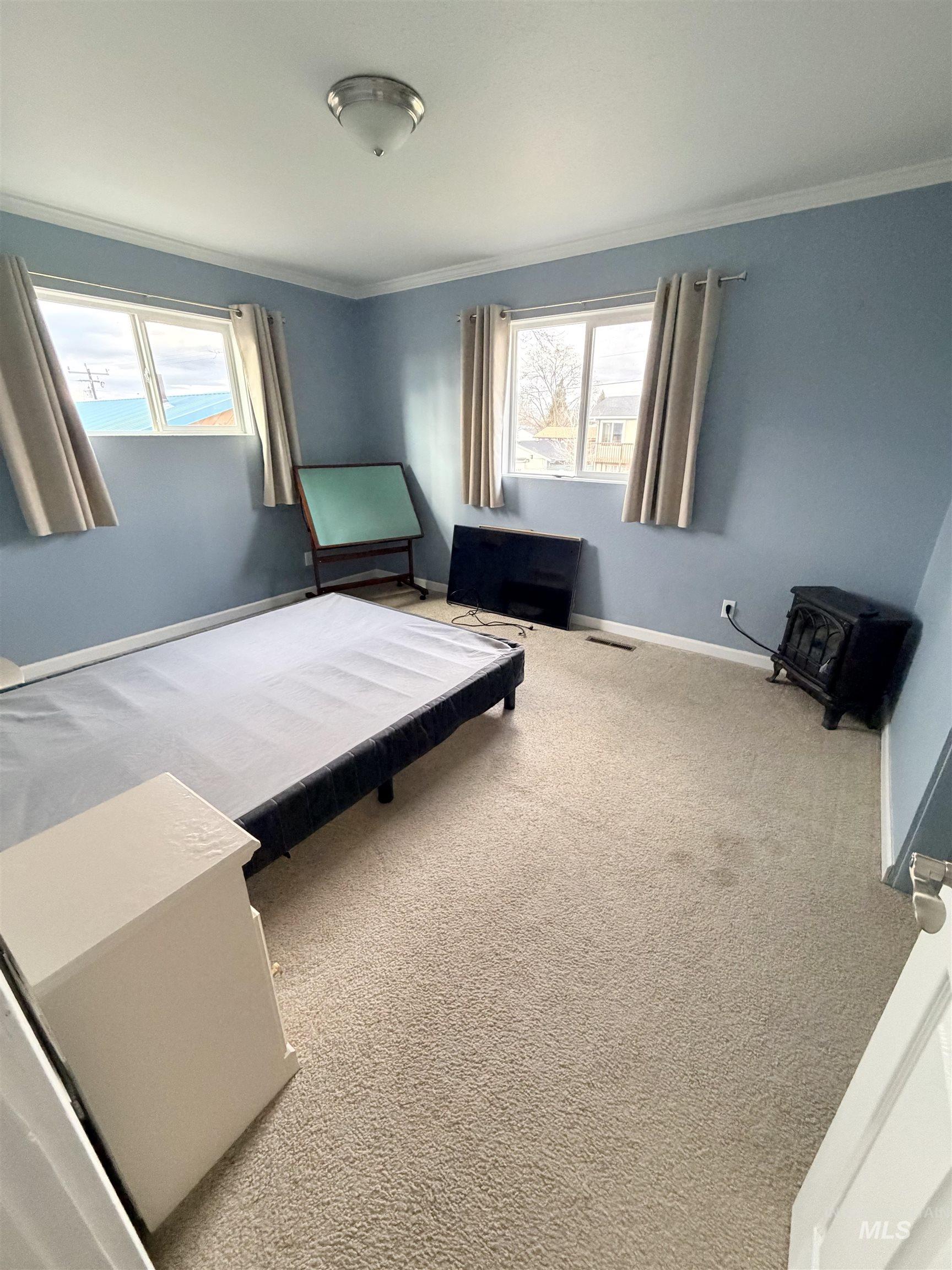 1306 Hemlock Avenue Lewiston, ID 83501 - Photo 17 of 38 Bedroom featuring carpet and ornamental molding