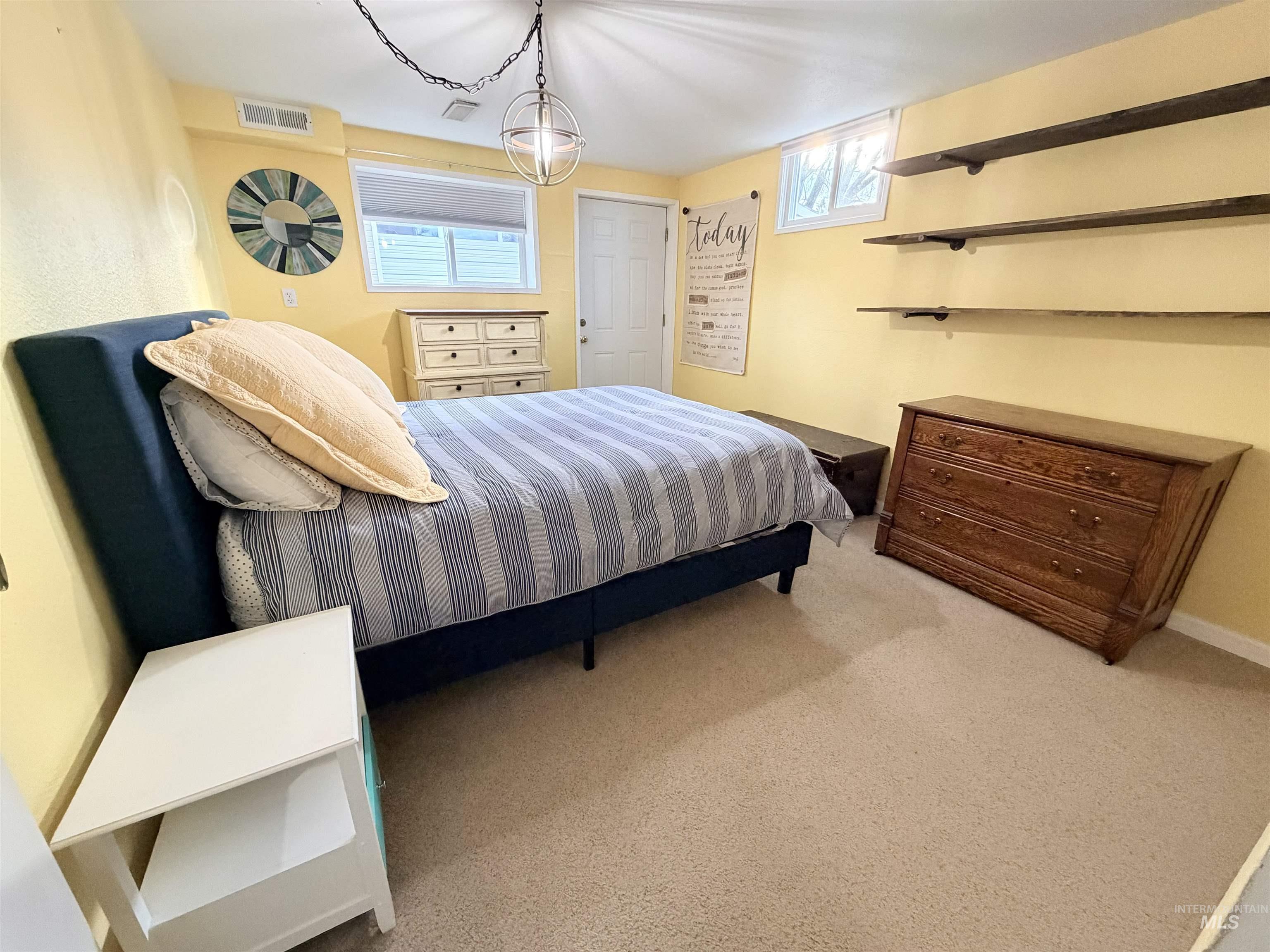 1306 Hemlock Avenue Lewiston, ID 83501 - Photo 23 of 38 Bedroom featuring light carpet and baseboards