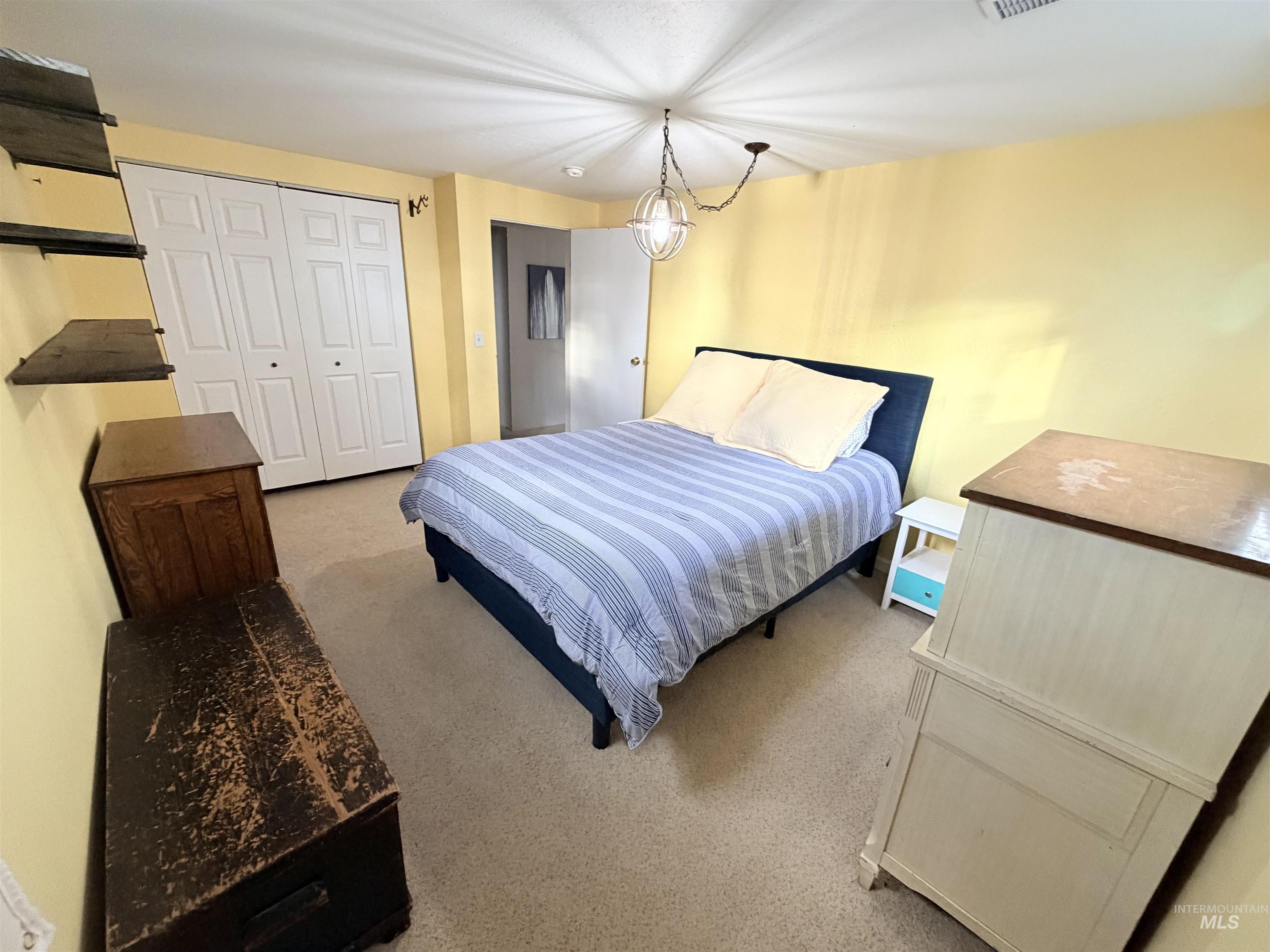 1306 Hemlock Avenue Lewiston, ID 83501 - Photo 24 of 38 Bedroom with light carpet and a closet