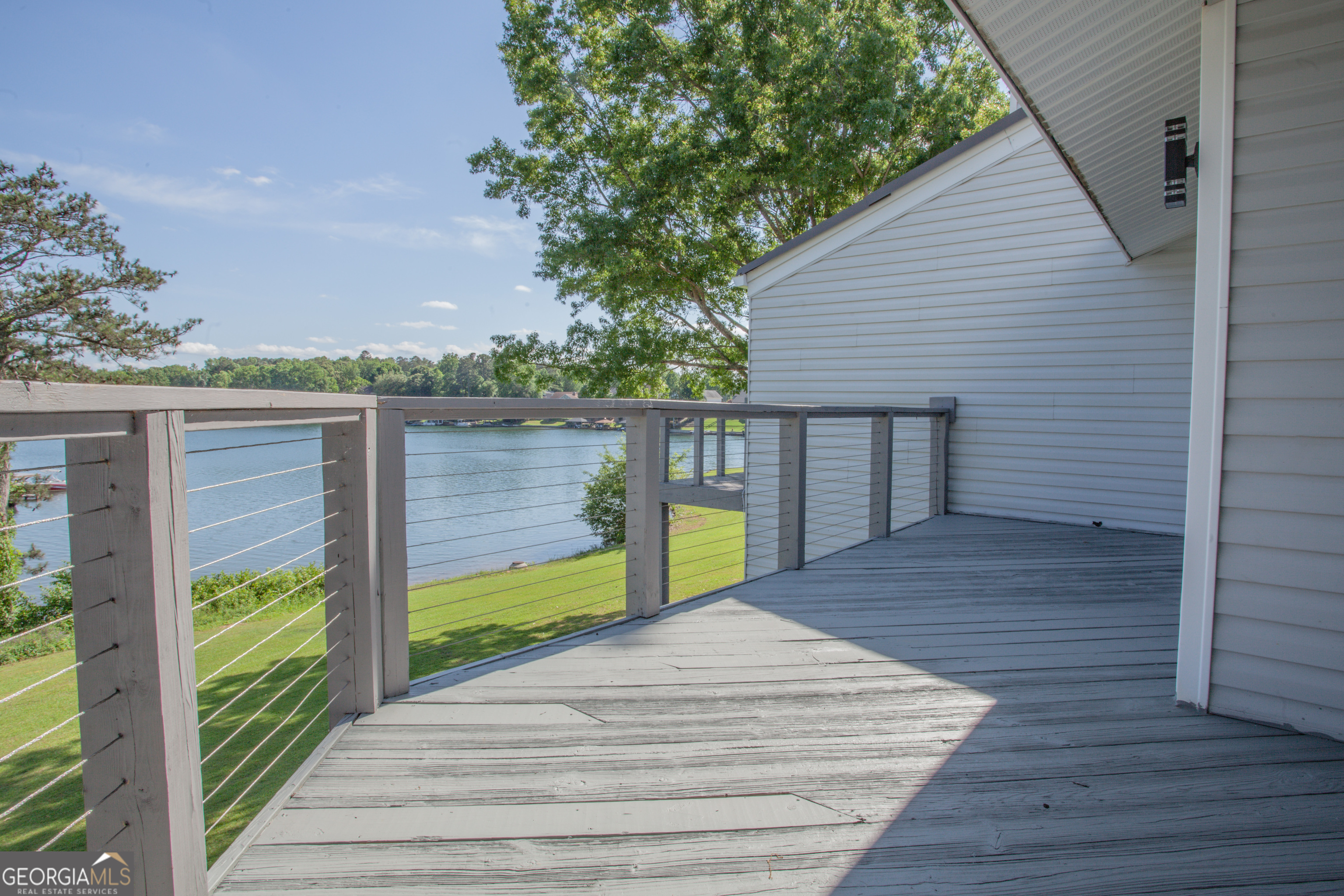 295 Clearview Court Villa Rica, GA 30180 - Photo 13 of 49 a view of a terrace with wooden floor and lake view