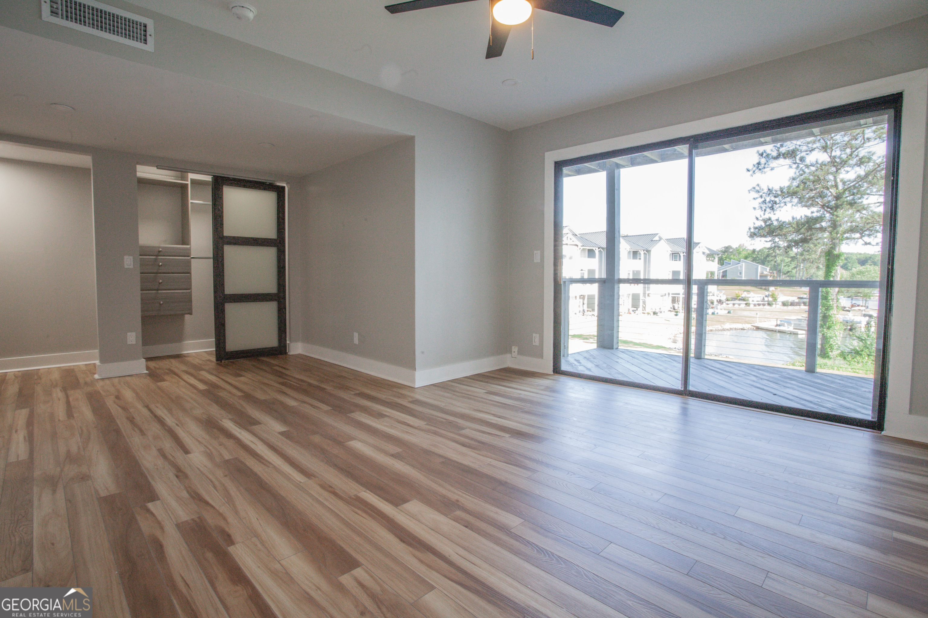 295 Clearview Court Villa Rica, GA 30180 - Photo 16 of 49 an empty room with wooden floor and windows