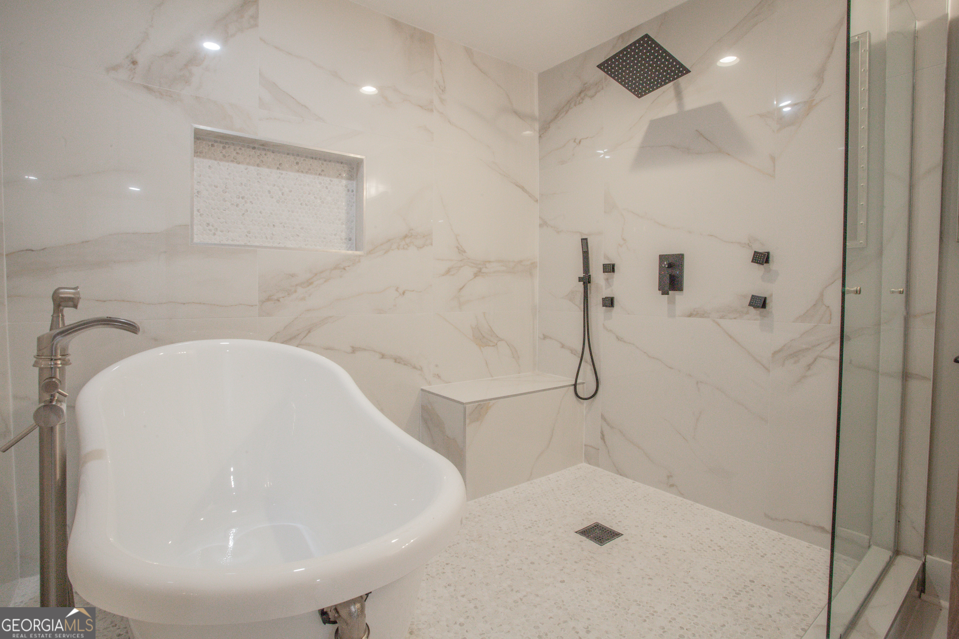 295 Clearview Court Villa Rica, GA 30180 - Photo 19 of 49 a bathroom with a bathtub and shower