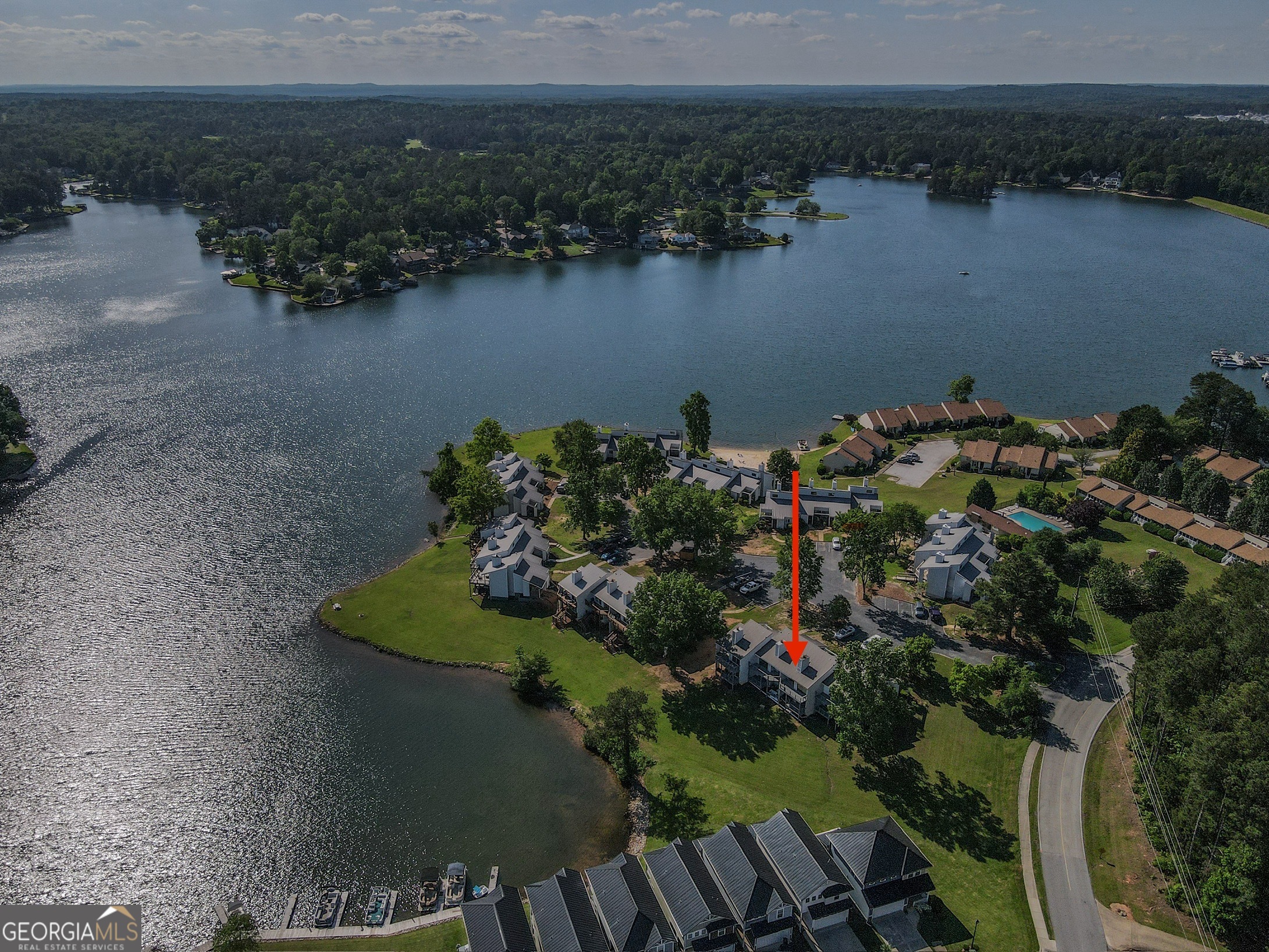 295 Clearview Court Villa Rica, GA 30180 - Photo 2 of 49 a view of a lake with a house