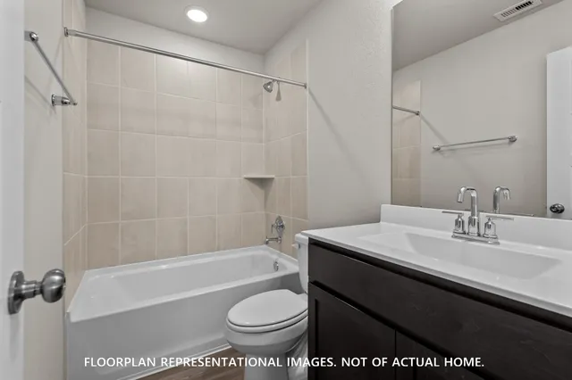 a bathroom with a sink a toilet and a bathtub