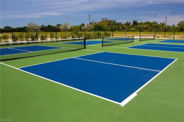 a view of an outdoor space and tennis court