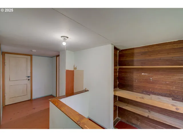 a view of an empty room and window