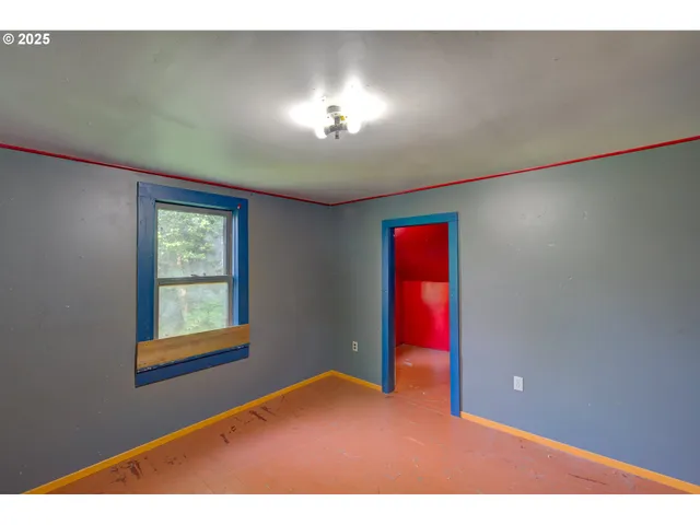 a view of an empty room and window