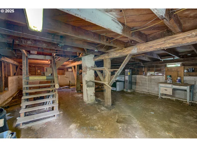 a view of a small house with wooden fence