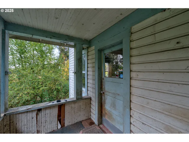 a view of outdoor space with wooden floor