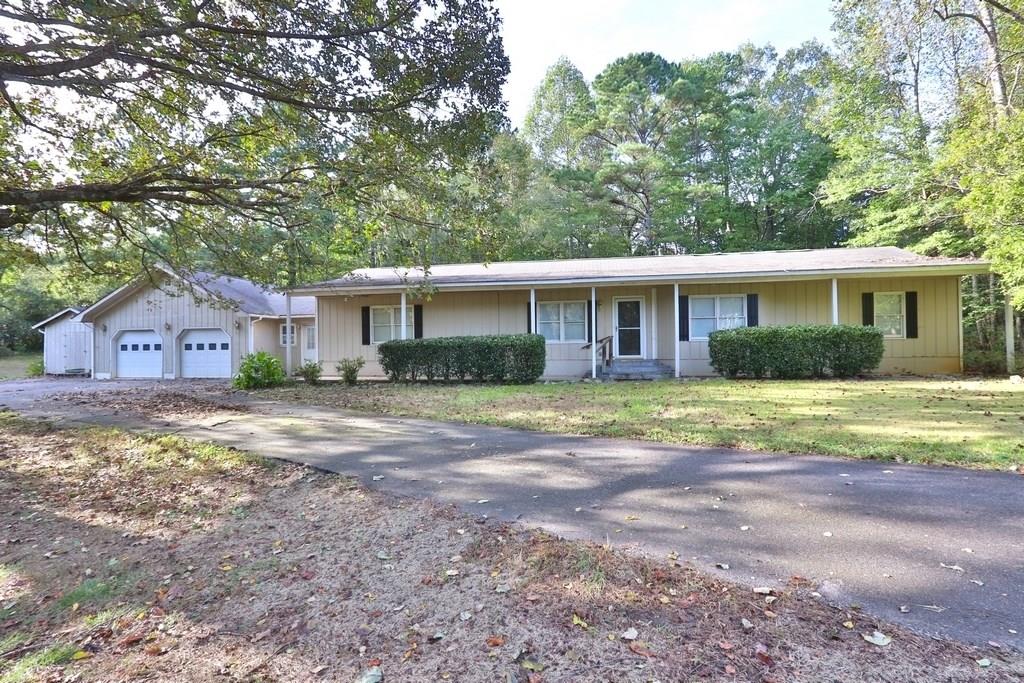 1840 Daves Creek Road Cumming, GA 30041 - Photo 1 of 1 a view of a house with a yard