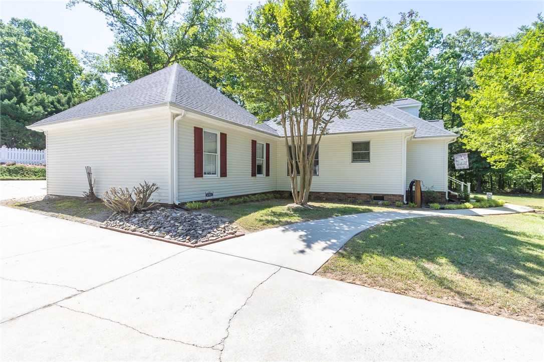 151 Hannah Circle Anderson, SC 29621 - Photo 6 of 46 This charming home features white siding, a paved driveway, and mature landscaping.