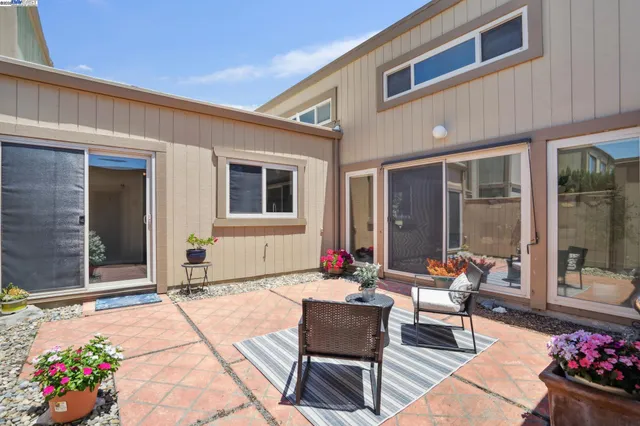 a outdoor space with patio the couch and flowers