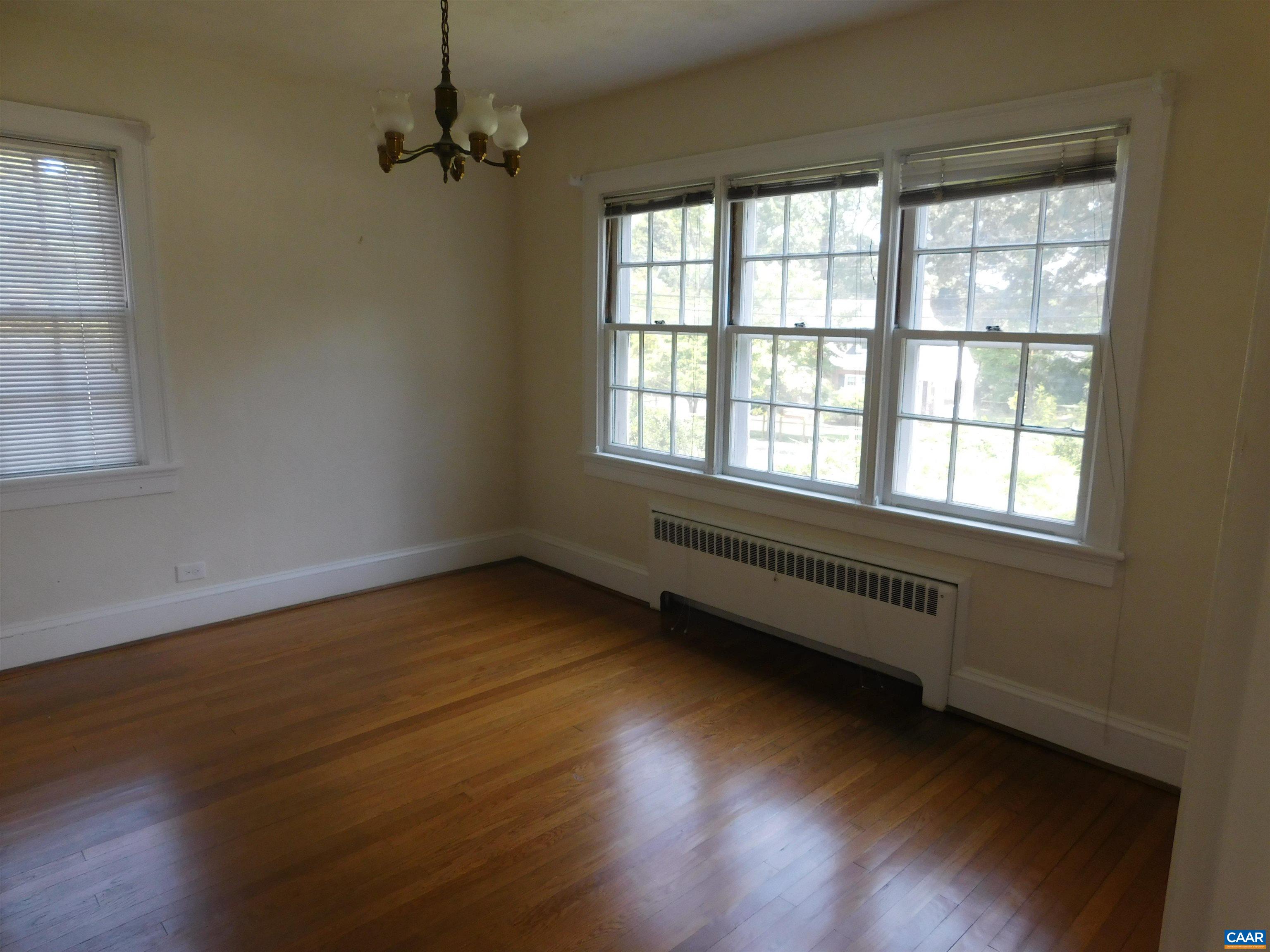 307 Alderman Road Charlottesville, VA 22903 - Photo 15 of 41 an empty room with wooden floor and windows