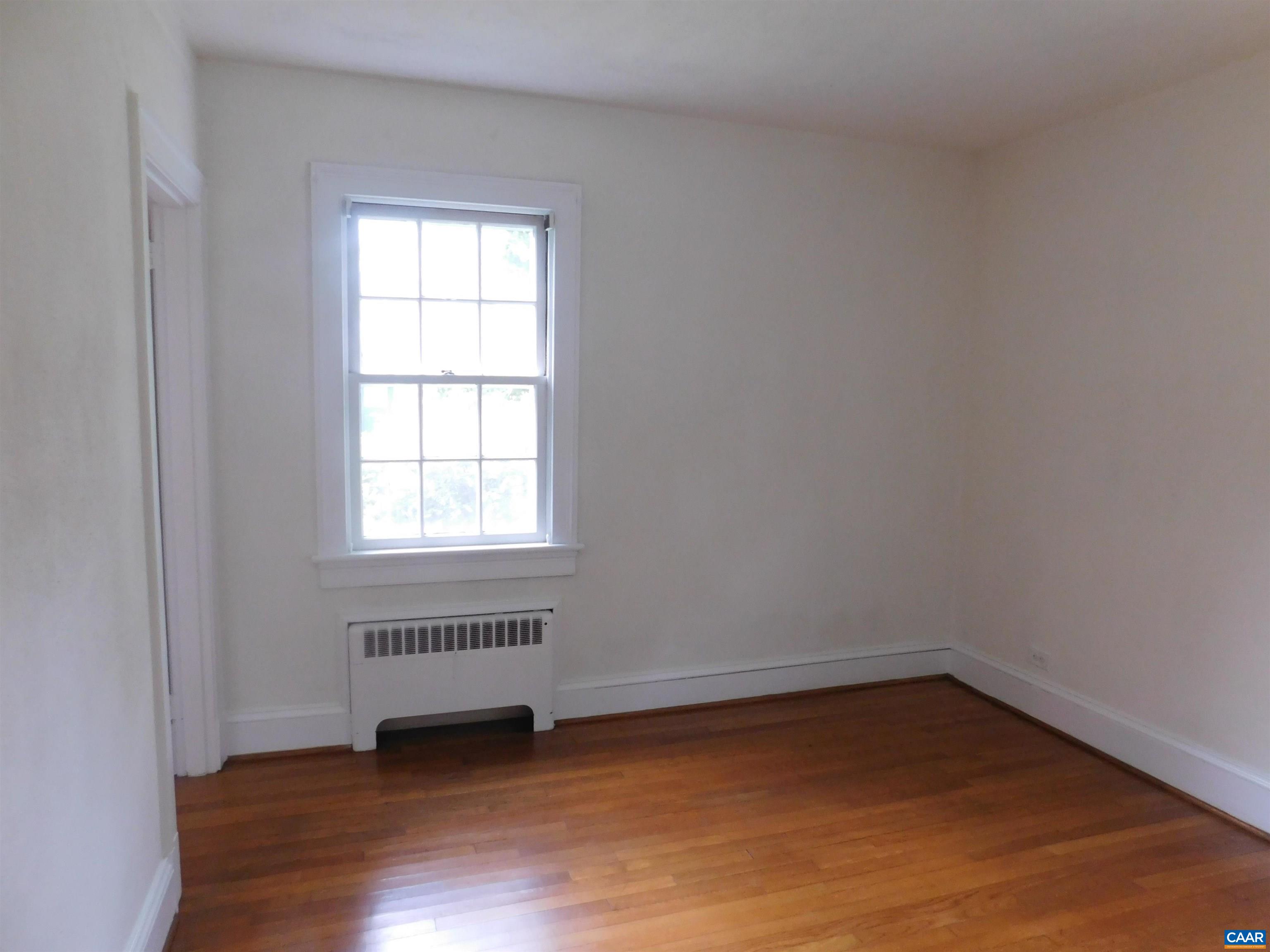 307 Alderman Road Charlottesville, VA 22903 - Photo 18 of 41 an empty room with wooden floor and windows