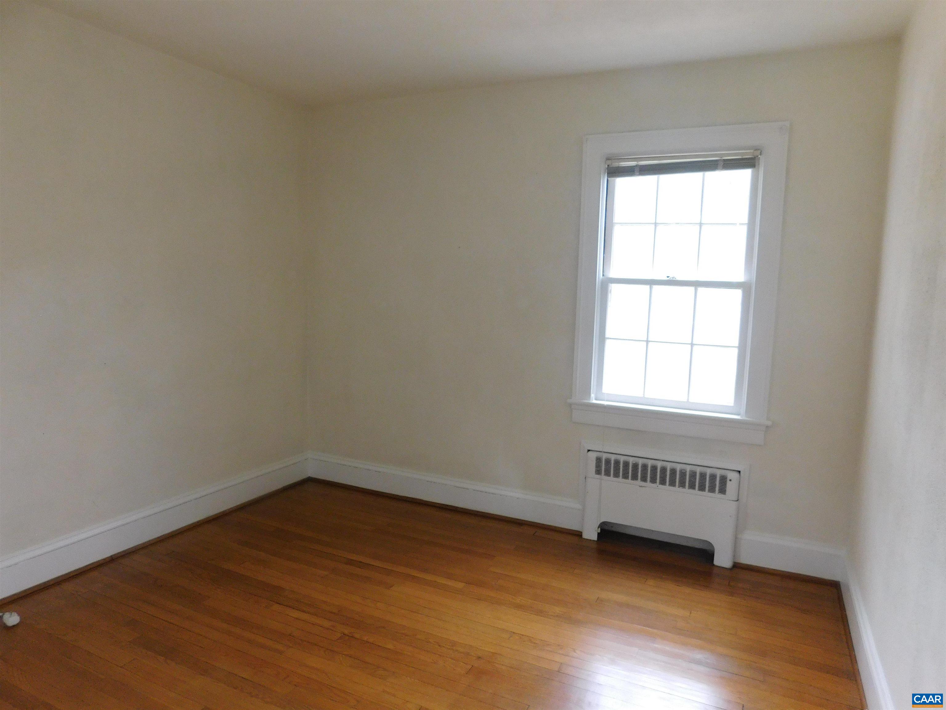 307 Alderman Road Charlottesville, VA 22903 - Photo 19 of 41 an empty room with wooden floor and windows