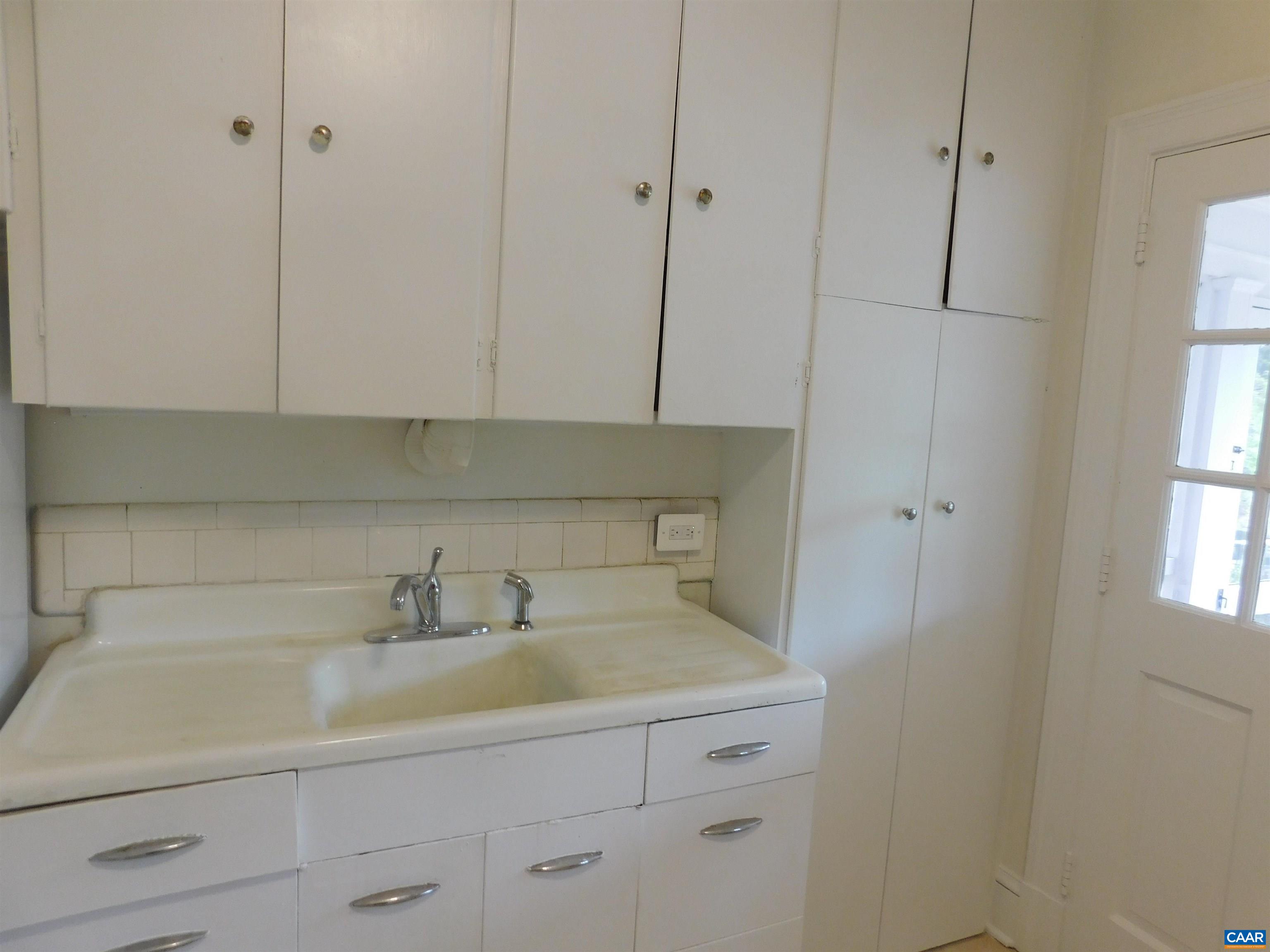 307 Alderman Road Charlottesville, VA 22903 - Photo 21 of 41 a kitchen with a sink and cabinets