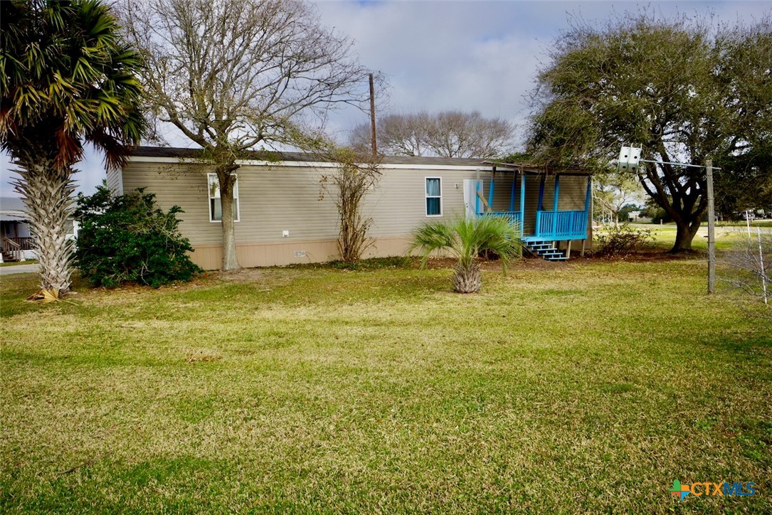 1502 West Monroe Avenue Port O'Connor, TX 77982 - Photo 1 of 22 a view of a house with a yard