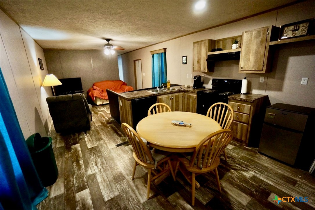 1502 West Monroe Avenue Port O'Connor, TX 77982 - Photo 11 of 22 a view of a dining room with furniture
