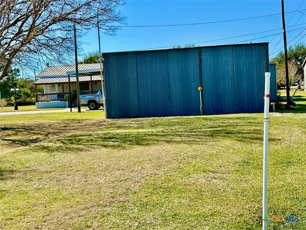 1502 West Monroe Avenue Port O'Connor, TX 77982 - Photo 22 of 22 a view of a house with a backyard