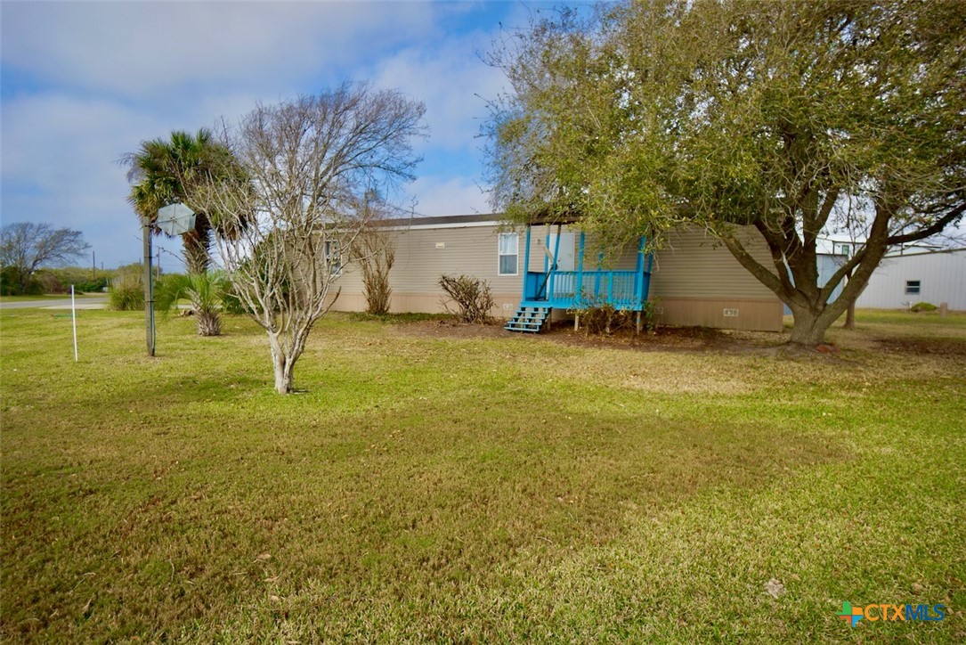 1502 West Monroe Avenue Port O'Connor, TX 77982 - Photo 3 of 22 a view of a yard with a house