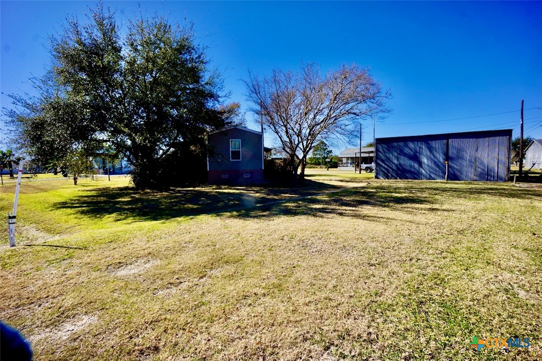 1502 West Monroe Avenue Port O'Connor, TX 77982 - Photo 7 of 22 a view of a yard with a house