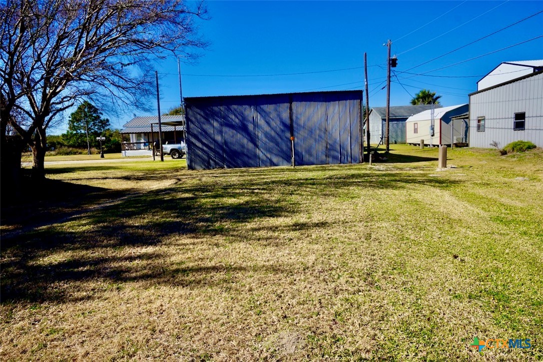 1502 West Monroe Avenue Port O'Connor, TX 77982 - Photo 8 of 22 a view of a house with a yard