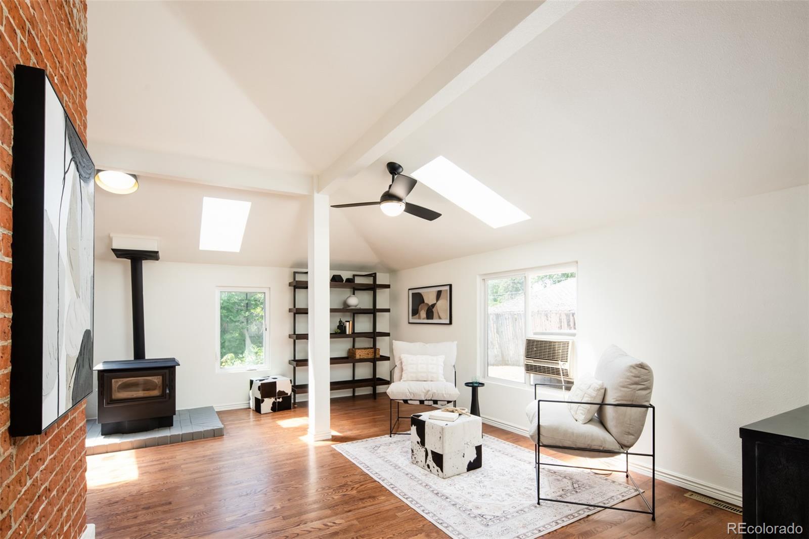 3519 L Newton Street Denver, CO 80211 - Photo 12 of 40 a living room with furniture and a wooden floor
