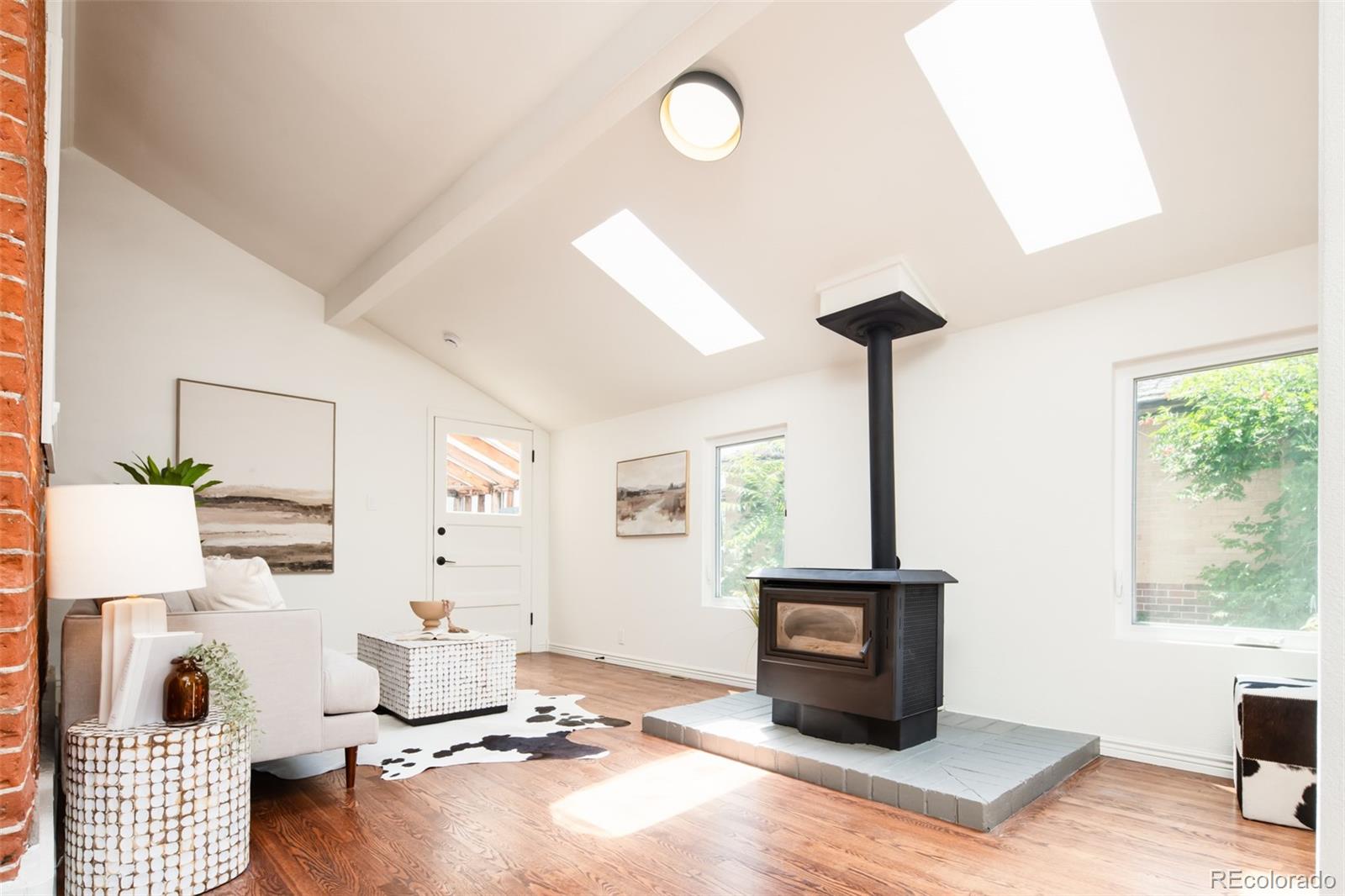3519 L Newton Street Denver, CO 80211 - Photo 15 of 40 a living room with furniture and a window