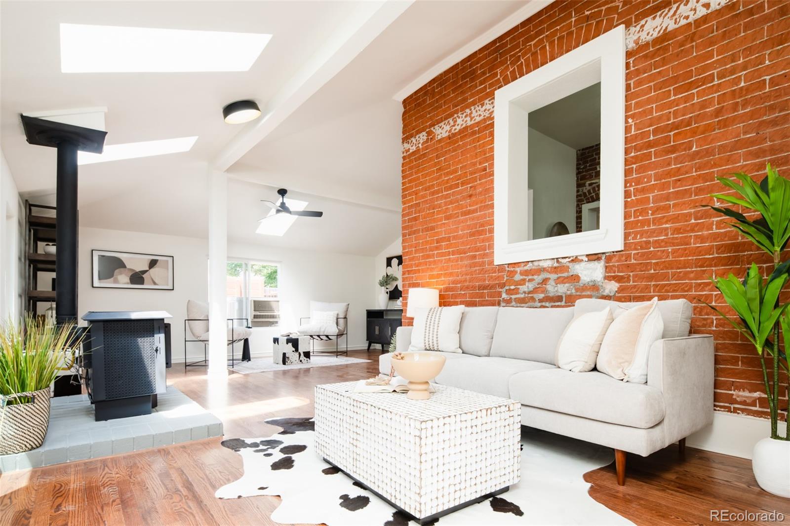 3519 L Newton Street Denver, CO 80211 - Photo 16 of 40 a living room with furniture and a fireplace