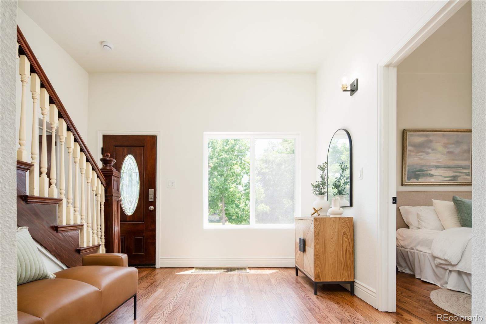 3519 L Newton Street Denver, CO 80211 - Photo 18 of 40 a living room with furniture and a window