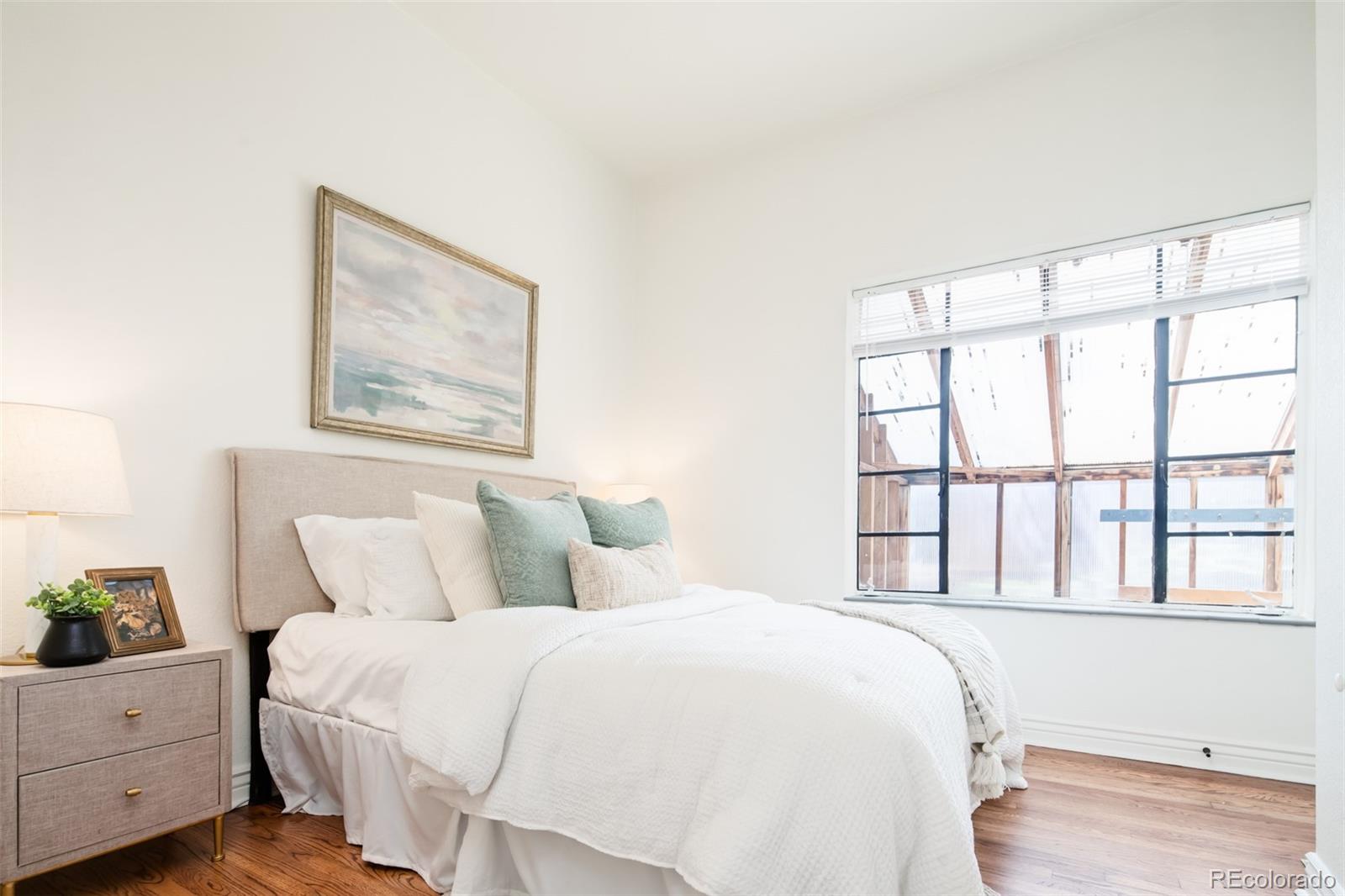 3519 L Newton Street Denver, CO 80211 - Photo 19 of 40 a bedroom with a bed and a window