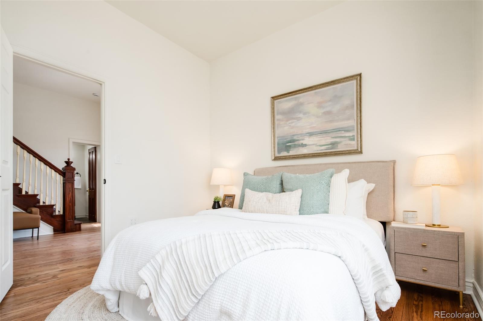 3519 L Newton Street Denver, CO 80211 - Photo 20 of 40 a bedroom with a bed and a painting on the wall