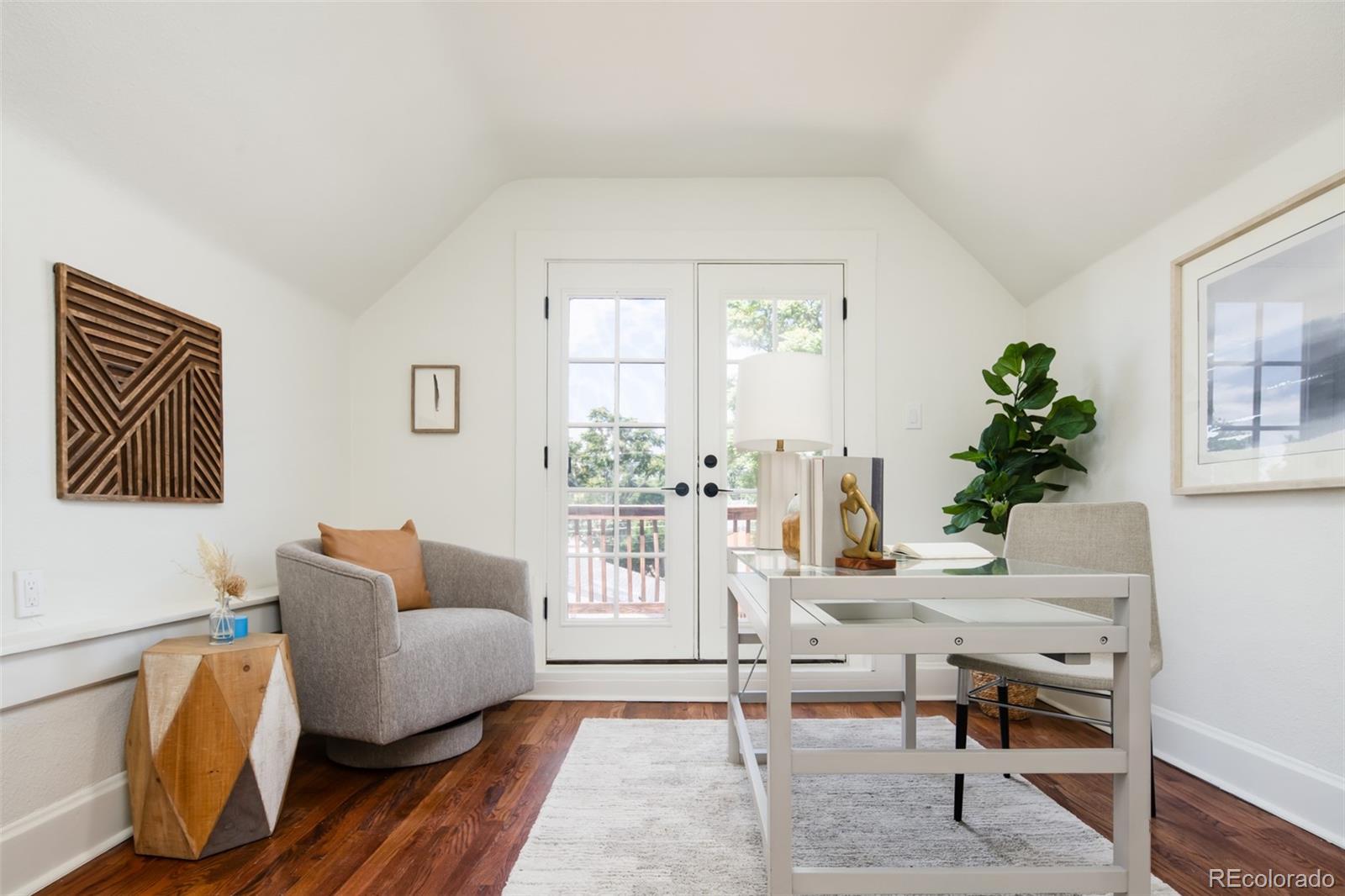 3519 L Newton Street Denver, CO 80211 - Photo 27 of 40 a living room with furniture and wooden floor