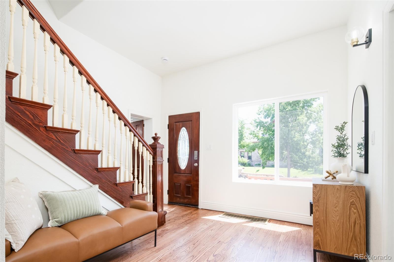 3519 L Newton Street Denver, CO 80211 - Photo 3 of 40 a living room with furniture and a large window
