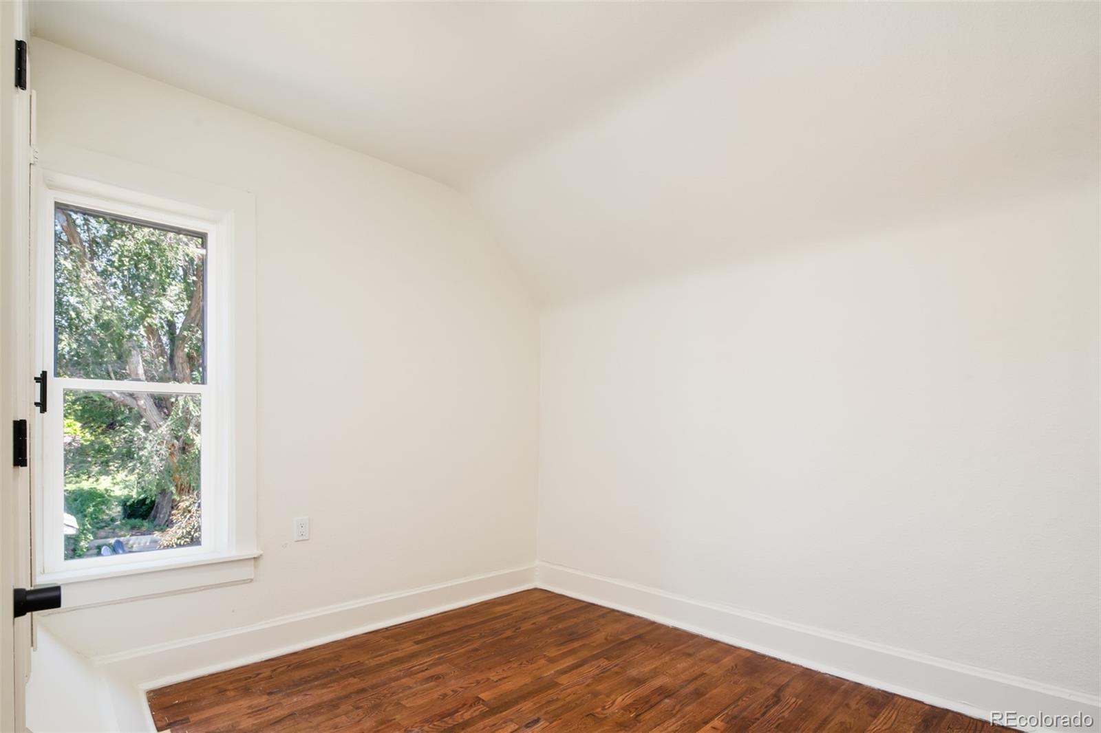 3519 L Newton Street Denver, CO 80211 - Photo 31 of 40 a view of a small space with wooden floor and a window