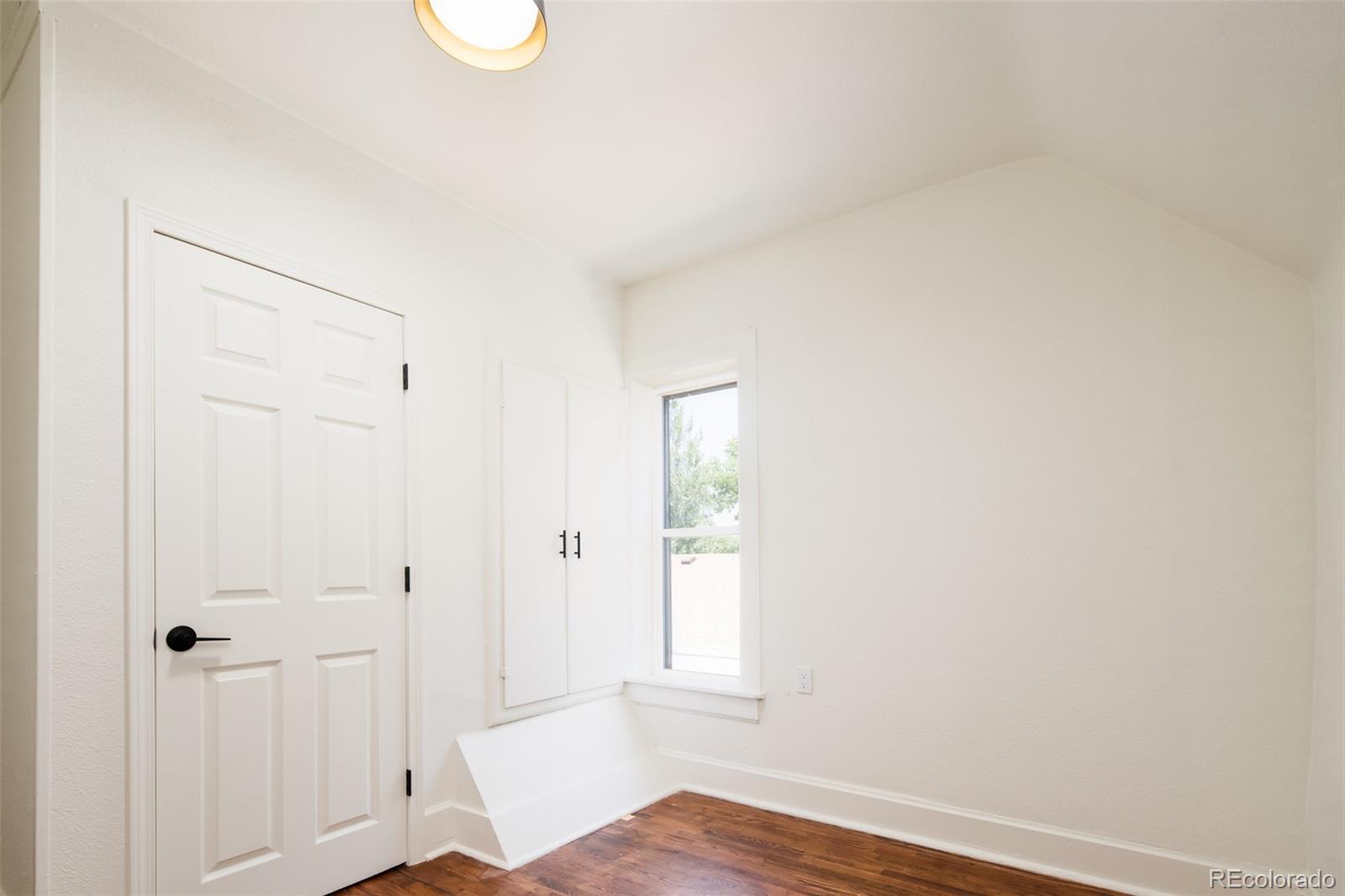 3519 L Newton Street Denver, CO 80211 - Photo 32 of 40 a view of empty room with wooden floor