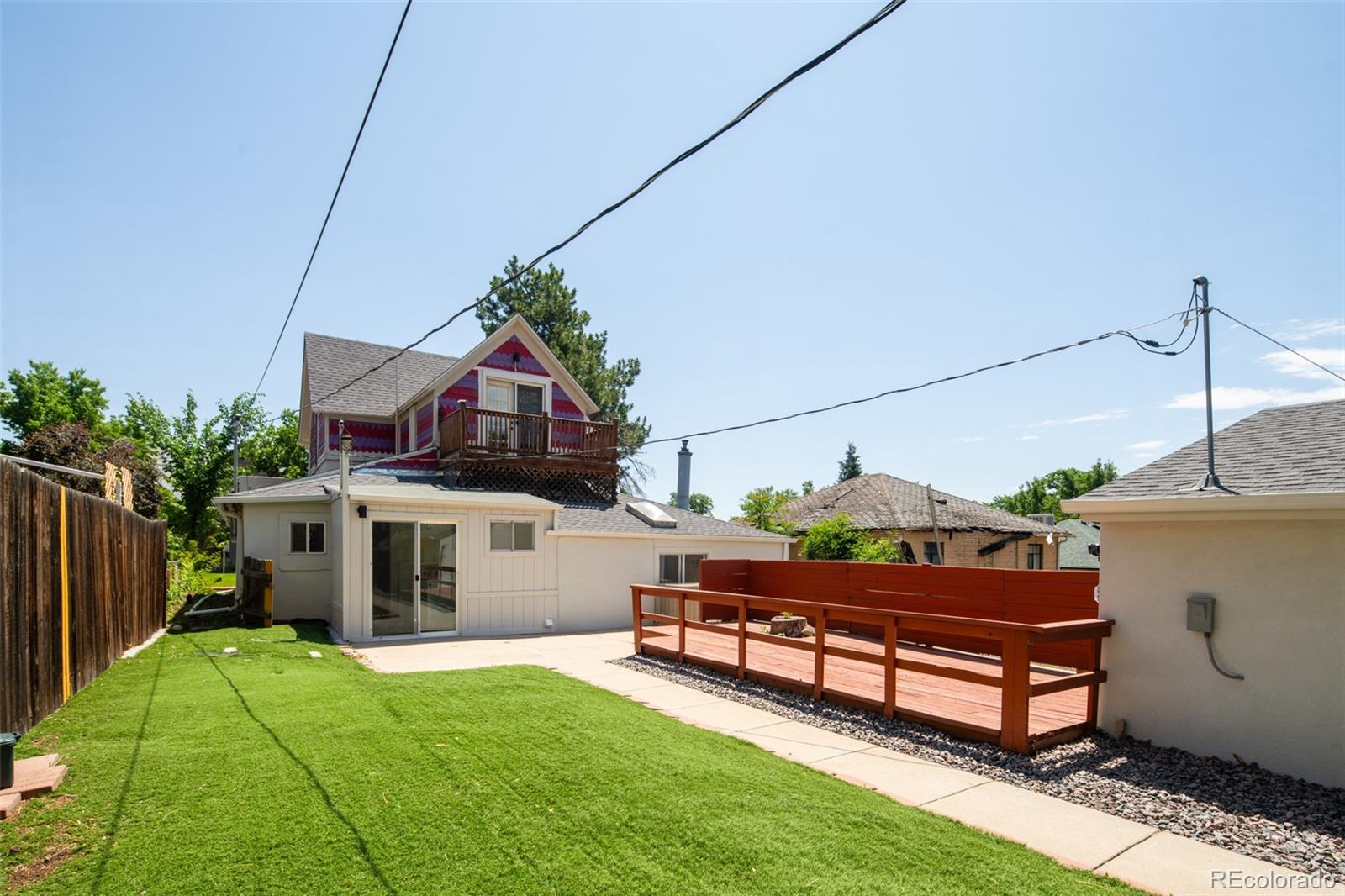 3519 L Newton Street Denver, CO 80211 - Photo 37 of 40 a backyard of a house with table and chairs