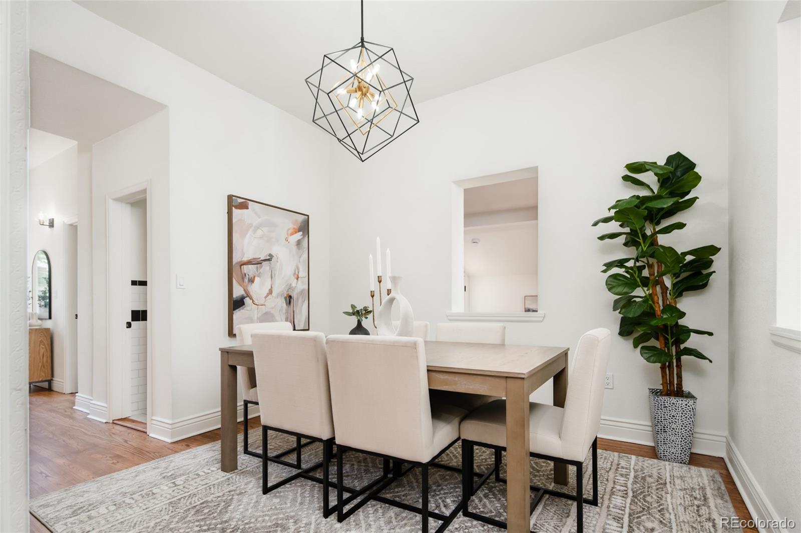3519 L Newton Street Denver, CO 80211 - Photo 4 of 40 a view of a dining room with furniture wooden floor and a chandelier